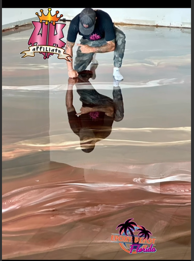Copper and rose metallic epoxy floor being worked during installation
